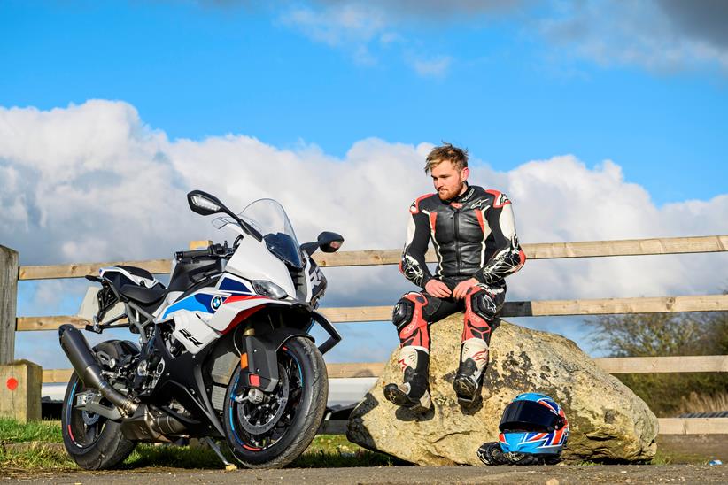 Carl Stevens sits by the BMW S1000RR