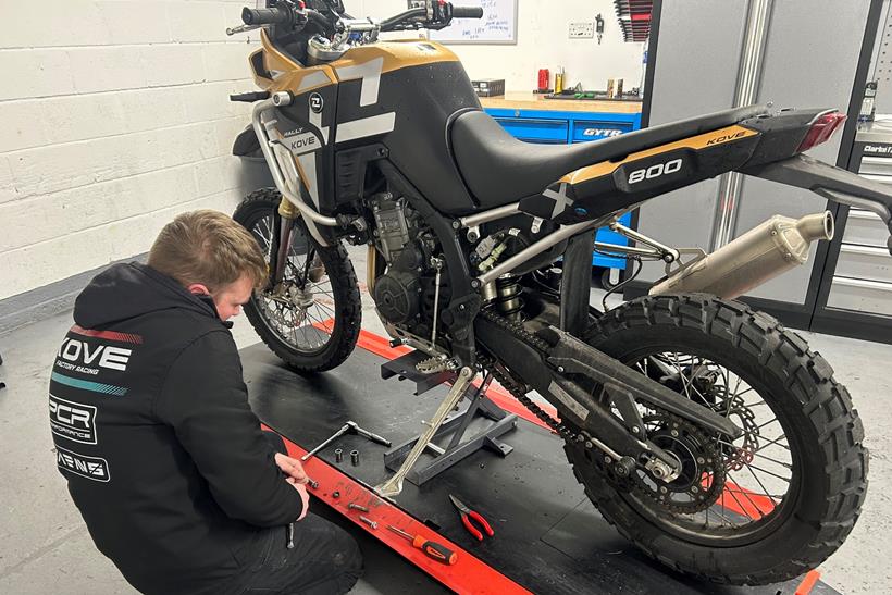 Kove 800X Rally, supported on a motorcycle lift 